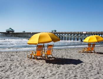 Chairs sitting on the beach Chairs sitting on the beach