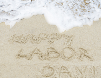 Labor day written in the sand Labor day written in the sand