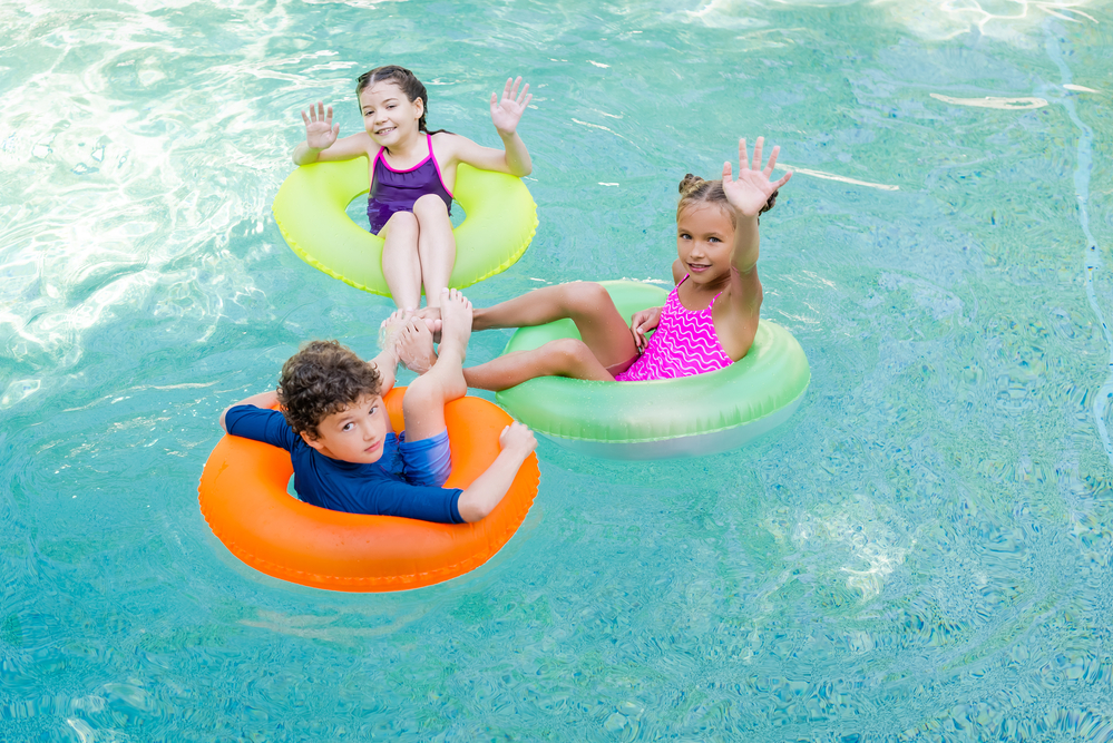 Children swim in a pool Children swim in a pool