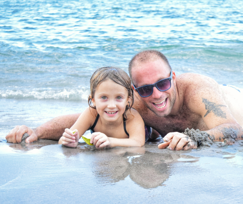 A father and daughter enjoy time on the beach A father and daughter enjoy time on the beach